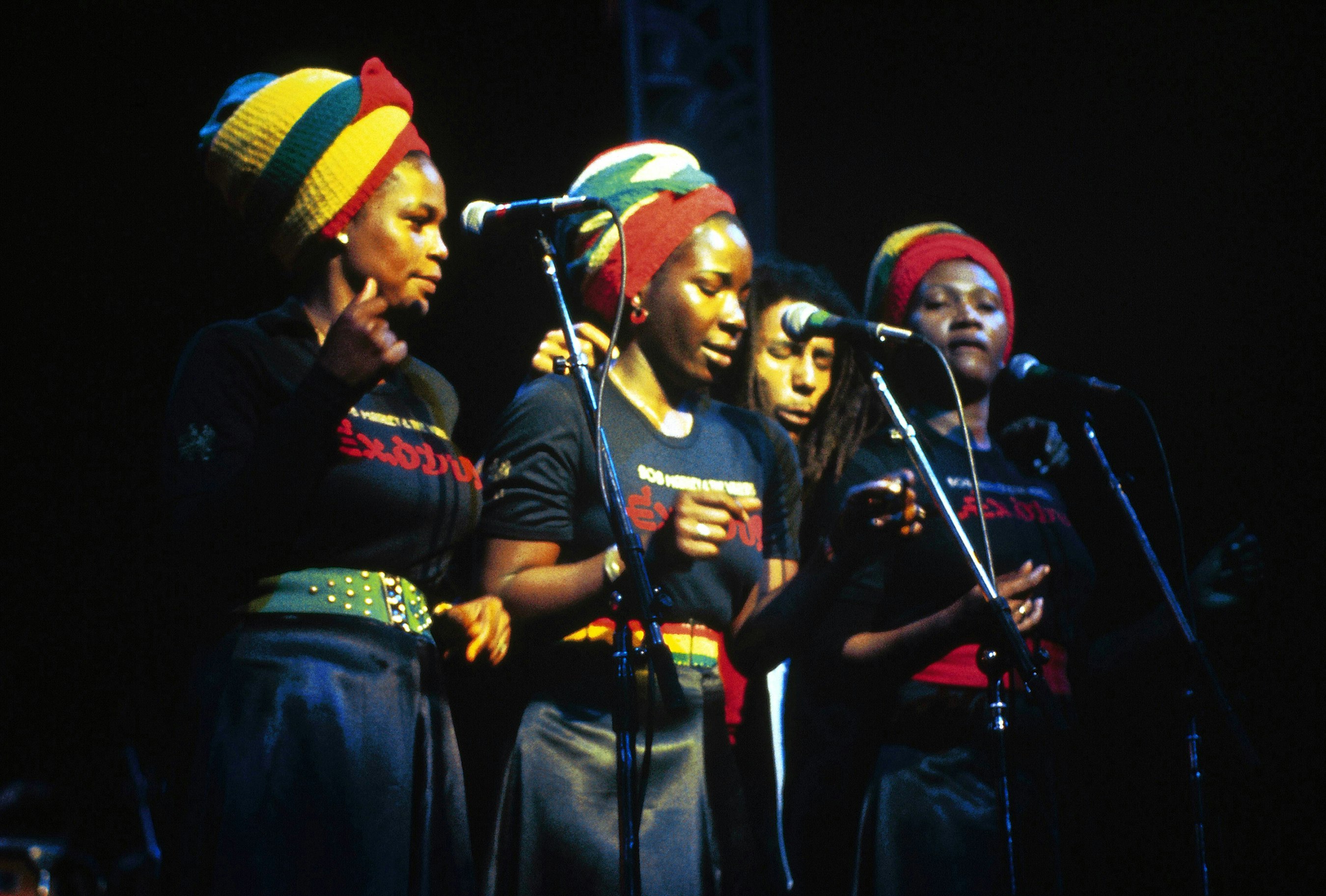 Bob Marley singing with the I-Threes (Judy Mowatt, Rita Marley, and Marcia Griffiths) during the Exodus tour at a four-night engagement at London’s Rainbow Theatre, June 3, 1977. Photo by Graham Wiltshire/Redferns.